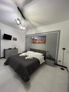 En eller flere senge i et værelse på D'Aversa Rooms + 23 billeder