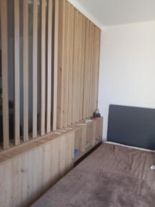a room with a wall with wooden panels at Chiara Kop in Bukorovac