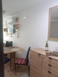 a room with a desk and a table and a chair at Chiara Kop in Bukorovac
