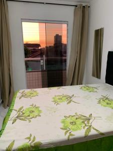 Ένα ή περισσότερα κρεβάτια σε δωμάτιο στο Aconchego Dutra