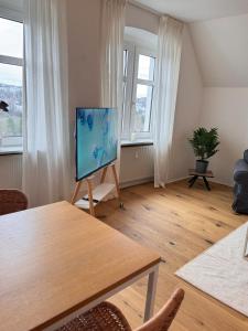 TV a/nebo společenská místnost v ubytování Cozy Apartment Klutert