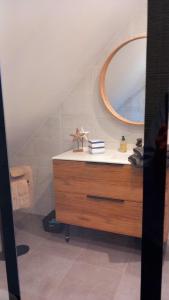 a bathroom with a sink and a mirror at BOCENNO Catherine in Ambon +6 photos