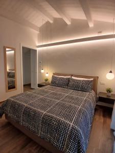 En eller flere senge i et værelse på Casa Emilio