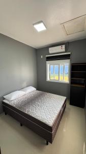 Ένα ή περισσότερα κρεβάτια σε δωμάτιο στο Casa Aconchegante Praia do Arpoador