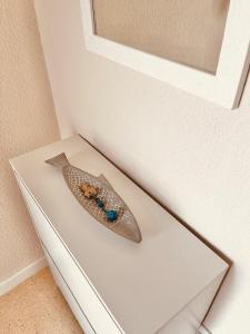a spoon sitting on top of a white drawer at Piso en Centro-Fortaleza Santa Pola in Santa Pola
