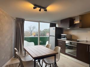 a kitchen and dining room with a table and chairs at Apartments Historic Center • Collection by Perpetual Relax in Braga