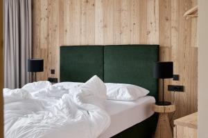 Ένα ή περισσότερα κρεβάτια σε δωμάτιο στο Lärchenlodge SkySpa and Rooftop Pool inklusive Stubai SuperCard +55 φωτογραφίες