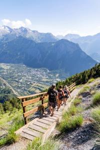 a group of people walking up a mountain trail at Demeure Sauvage - Étage 2 in Villard-Reculas