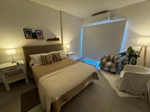 Llit o llits en una habitació de Departamento Studio