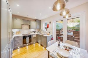 a kitchen with a table and chairs and a dining room at Two Bed Home in Portishead in Portishead