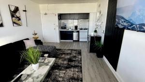 a living room with a couch and a table at Luxury Skyrise Condo Downtown Jax in Jacksonville