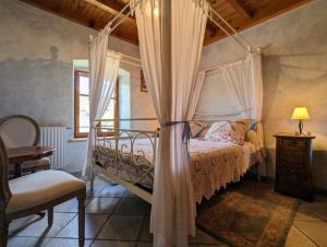 Ένα ή περισσότερα κρεβάτια σε δωμάτιο στο Chambre d'hôtes à Vousse