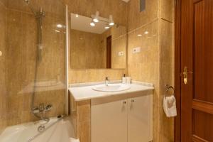 a bathroom with a sink and a shower at Apartamentos Miguel Angel in Estepona +84 photos
