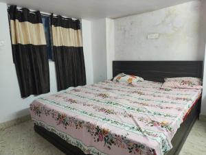 Ένα ή περισσότερα κρεβάτια σε δωμάτιο στο Sai Guest House +9 φωτογραφίες