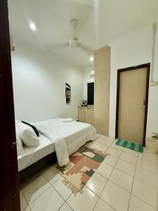 Ένα ή περισσότερα κρεβάτια σε δωμάτιο στο The Nest2 Cozy Home Seksyen 7 Shah Alam