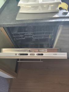 an oven with its door open in a kitchen at Haus Kraus in Bayerisch Eisenstein +92 photos