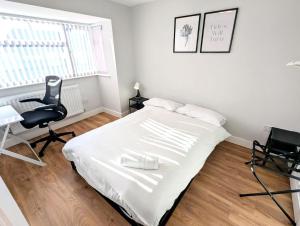 En eller flere senge i et værelse på 3 bedroom, 3 en-suite modern home