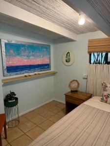 Postel nebo postele na pokoji v ubytování The Beach Bungalows Tamarindo- Adults Only