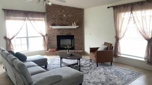 a living room with a couch and a fireplace at Cozy Private Room in Milton near Beaches in Milton