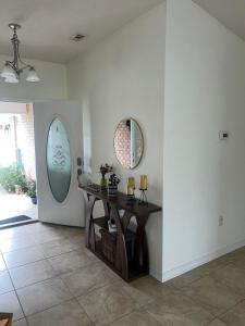 a room with a table and a mirror on the wall at Cozy Private Room in Milton near Beaches in Milton