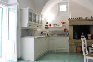 Η κουζίνα ή μικρή κουζίνα στο Casa Maricla - Marea Stays Collection +12 φωτογραφίες