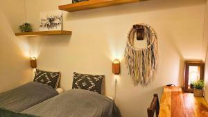 a bedroom with two beds and a mirror on the wall at Riverfront Aurora Chalet in Kiruna +33 photos