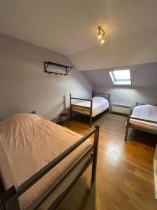 Ένα ή περισσότερα κρεβάτια σε δωμάτιο στο Gîte 9 couchages idéal pro BTP Tancarville