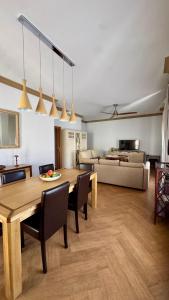 a living room with a table and a couch at Galteo Remedios in Ronda