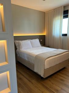 Кровать или кровати в номере Apartamento 100m da Praia Brava - Itajaí +26 фотографий