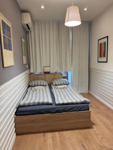 Ένα ή περισσότερα κρεβάτια σε δωμάτιο στο Happy Day