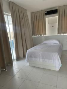 Giường trong phòng chung tại Zile Hotel