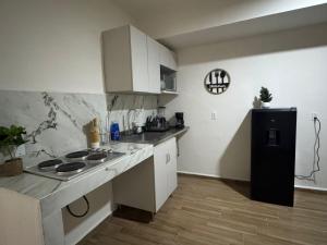 Η κουζίνα ή μικρή κουζίνα στο Super comfortable apartment in a great location +3 φωτογραφίες