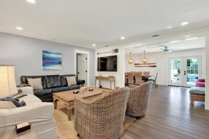 a living room with a couch and a table at The Oar House in Tybee Island