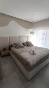 Ένα ή περισσότερα κρεβάτια σε δωμάτιο στο Adagio Executive Suite La Carolina Quito