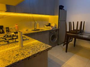 Η κουζίνα ή μικρή κουζίνα στο Moderne spacieux cosy