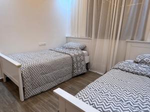 Ένα ή περισσότερα κρεβάτια σε δωμάτιο στο Moderne spacieux cosy