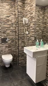 a bathroom with a sink and a toilet at Be Oporto Apartments Clérigos in Porto +58 photos