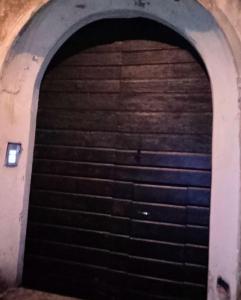a dark tunnel with a bunch of stairs at A un passo dal centro gli orsetti del duomo in Piacenza