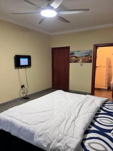 Ένα ή περισσότερα κρεβάτια σε δωμάτιο στο Adomfie