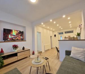 a living room with a couch and a table at Apartman Anita in Kupres