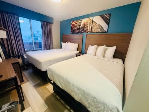 Ένα ή περισσότερα κρεβάτια σε δωμάτιο στο Days Inn by Wyndham Brooklyn Borough Park +20 φωτογραφίες