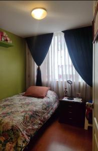 Un pat sau paturi într-o cameră la De los Olivos