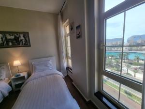 Ένα ή περισσότερα κρεβάτια σε δωμάτιο στο استوديو المارينا