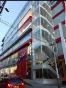 a car parked in front of a building at Hotel Amiraty in Ipiales