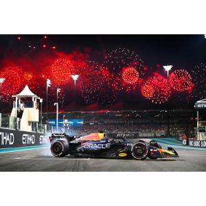 a racing car on the track at night at Darkwood Haven - Luxe 2BR Duplex Stay in Oasis, Near Masdar City- 18 Minutes From Grandprix in Abu Dhabi