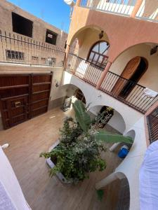 an overhead view of a building with stairs and plants at Sunny Surf Riad apartment in Tamraght in Agadir +7 photos