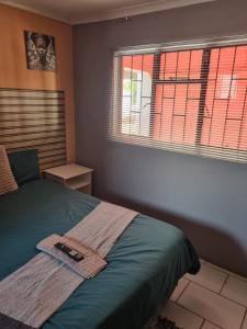 Ένα ή περισσότερα κρεβάτια σε δωμάτιο στο Phadimane guest house