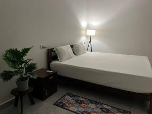 Ένα ή περισσότερα κρεβάτια σε δωμάτιο στο The Ashvem Horizon