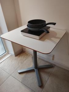 a pan sitting on top of a white table at Cozy 40 minutes from Geneva & Annecy in Bassy