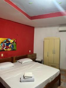 Postel nebo postele na pokoji v ubytování Pousada Rosa Mistica